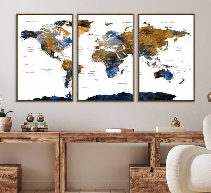 The Triptych Modern World Map Canvas in blue and brown is an ideal global decor piece for enhancing living rooms or offices. It comes ready to hang.