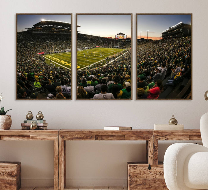 The Oregon Stadium Canvas Wall Art features a depiction of a packed Autzen Stadium with OREGON prominently displayed on the field.