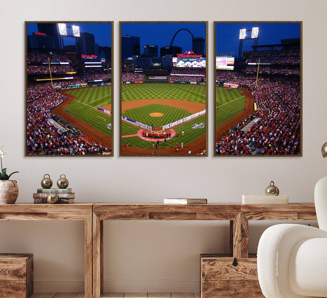 A Cardinals wall art canvas print depicts Busch Stadium with players lined up on the field and a full audience under the lights, capturing the vibrant atmosphere.