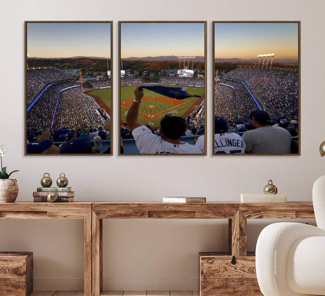 A triple canvas wall art captures the scene at Dodger Stadium, with fans cheering as the sun sets and a flag waving on the field.