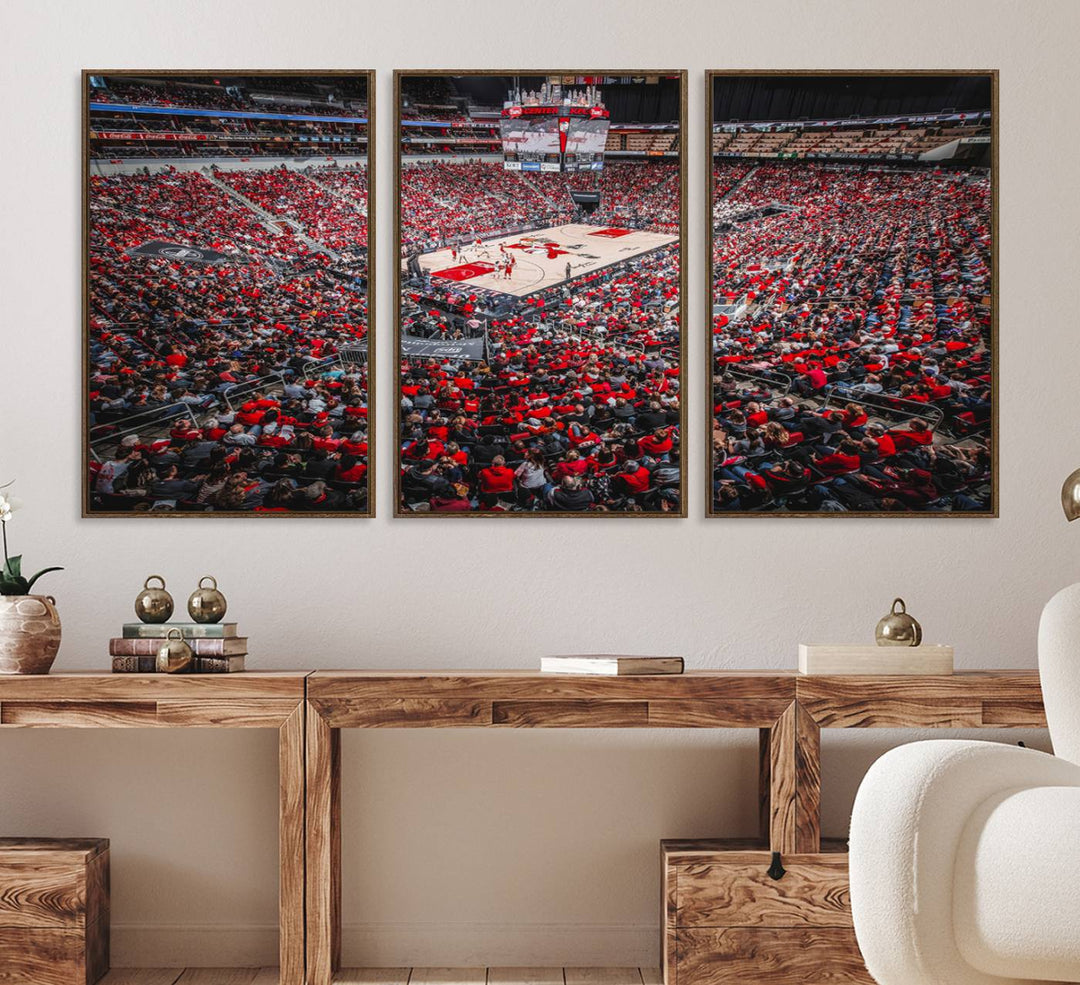 A painting of Louisville Cardinals fans in red at the KFC Yum Center Arena.