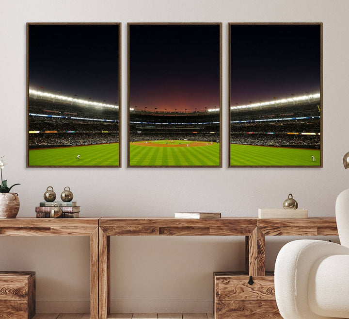 A night game at Yankee Stadium depicted on canvas beneath a sunset sky.