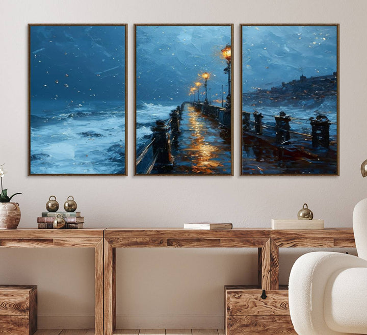 A framed oil painting depicts a stormy night at a beach pier, with glowing lamps and waves beneath a snow-filled sky.