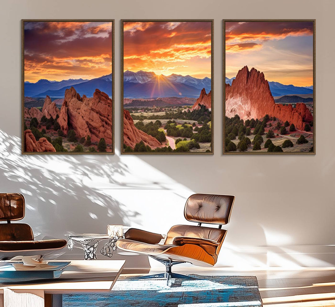 A vibrant sunset over the Rocky Mountains with red rocks.