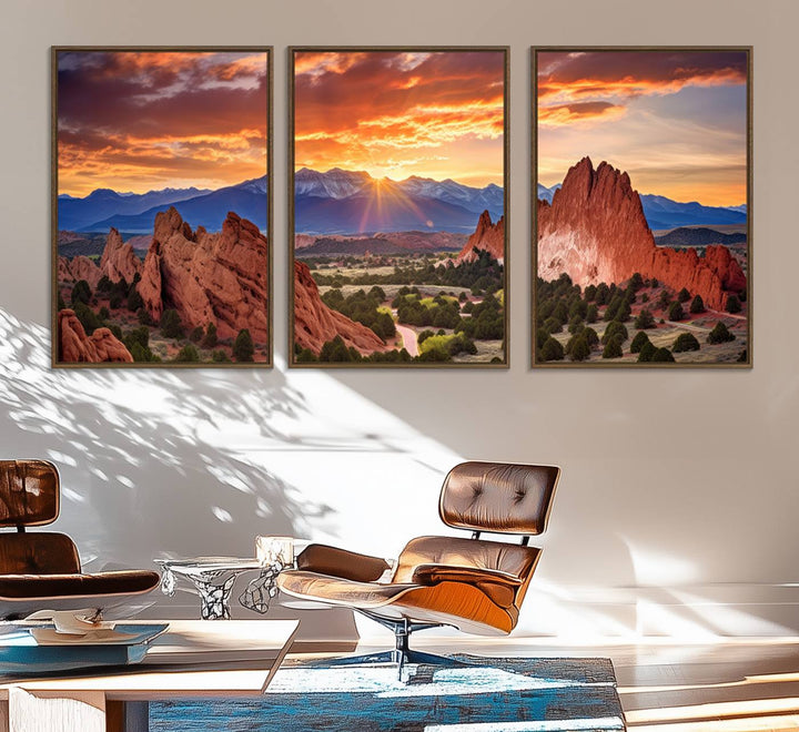 A vibrant sunset over the Rocky Mountains with red rocks.