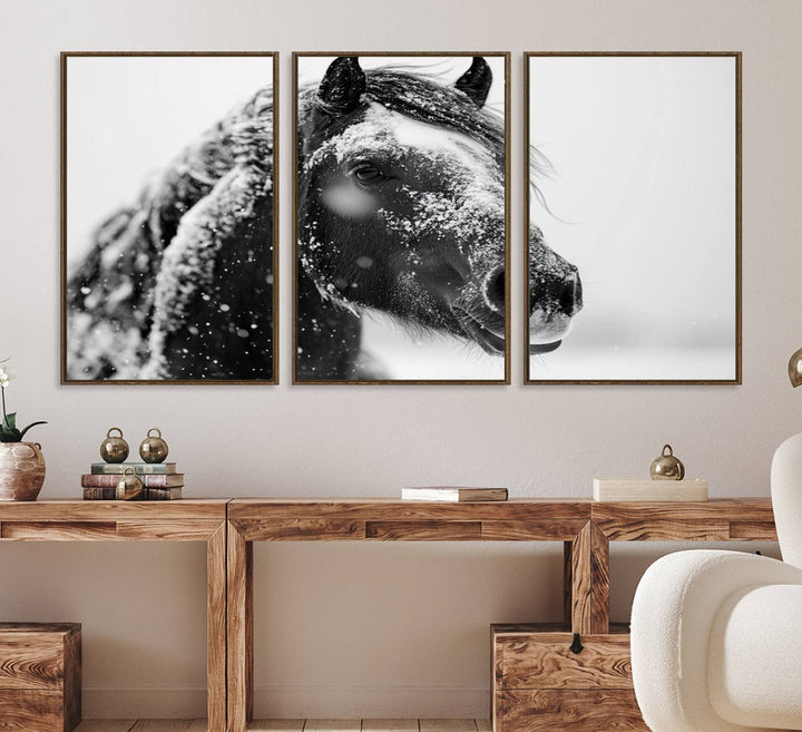 A large 3-panel rustic farmhouse wall art showcases a black and white winter horse canvas print against a snowy backdrop.