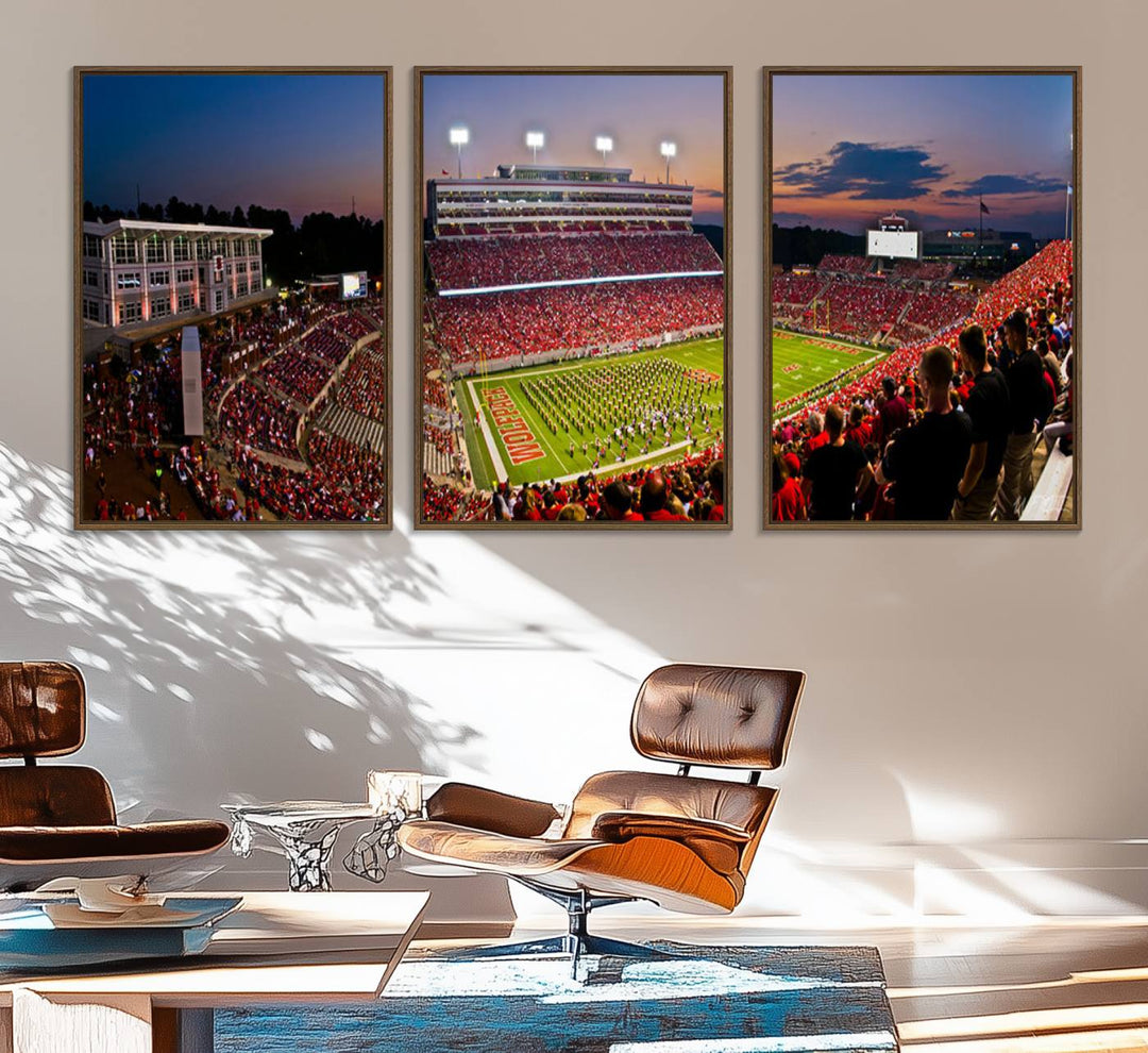 A print of a bustling Carter-Finley Stadium at dusk, featuring fans and a band, captures the essence of NC State Wolfpack football.