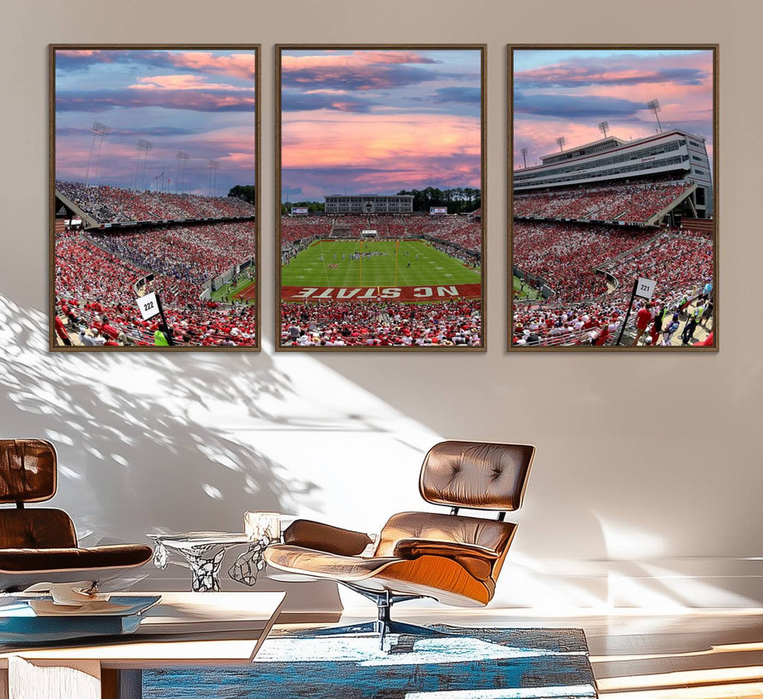 The wall art captures an NC State Wolfpack game under a vibrant sunset on triple canvas.