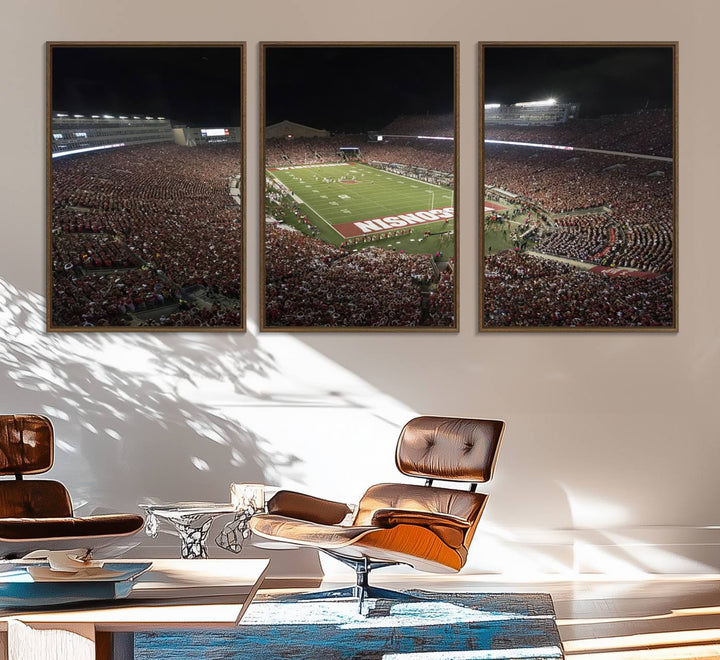 A painting of a stadium packed for a Wisconsin Badgers game, with WISCONSIN clearly visible in the end zone at Camp Randall Stadium.