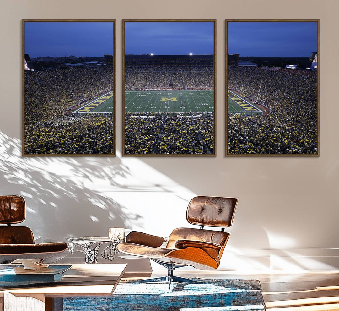 Wall art featuring an aerial shot of Michigan Stadium at dusk, showcasing the University of Michigan Wolverines M logo.