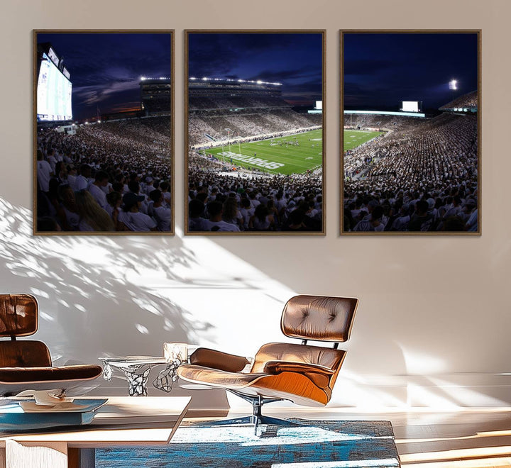 A packed football stadium at night, with bright lights and fans in white, depicted in a Michigan State Spartans Stadium wall art.