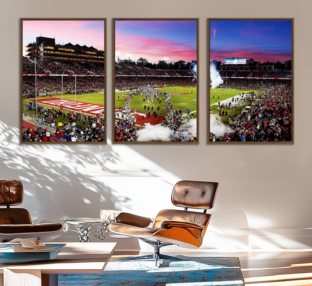 The wall art features a canvas print of the Stanford Cardinal football team, capturing players, fireworks, and smoke against the backdrop of a sunset at Stanford Stadium.