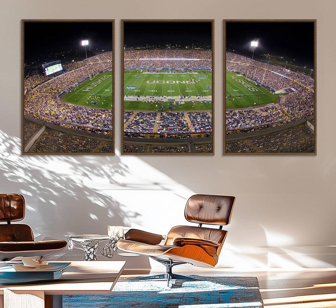 A large football stadium at night, featuring the UCONN Huskies, is depicted on the East Hartford Pratt & Whitney Stadium Wall Art Canvas Print.