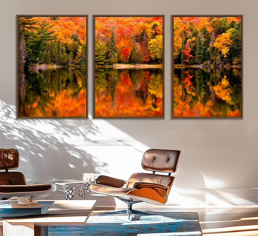 Autumn Forest Reflection Wall Art: a vibrant triptych canvas featuring fall foliage with red, orange, and yellow leaves over a calm lake.