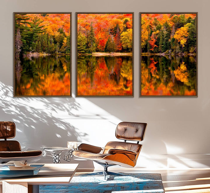 Autumn Forest Reflection Wall Art: a vibrant triptych canvas featuring fall foliage with red, orange, and yellow leaves over a calm lake.