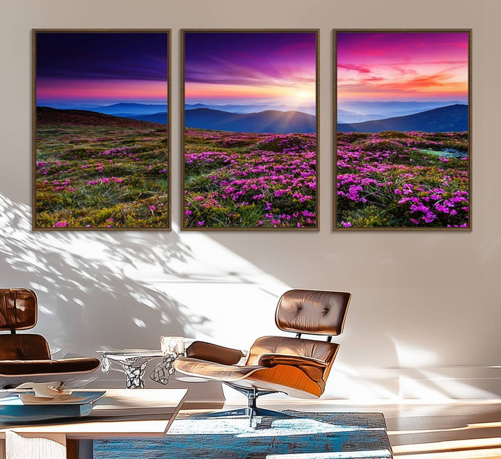 A 3-panel landscape photography canvas of a sunset over mountain meadows with purple wildflowers decorates the wall.