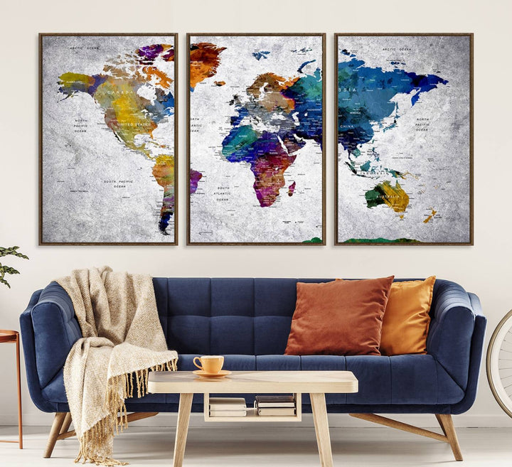 The World Map Art Canvas Print, featuring country names on a grunge-stained gray background, is perfect for stylish home decor.