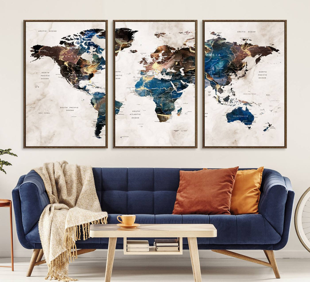 Abstract earth-toned 3-panel world map wall art featuring blues and browns, ready to hang; it showcases continents on modern canvas.