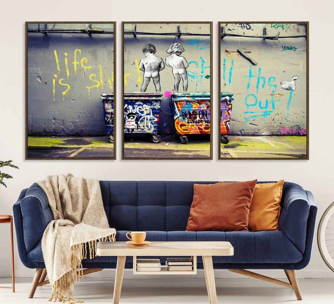 Banksys Life is Short graffiti, featuring kids and text, decorates the wall as a striking piece of framed canvas art.