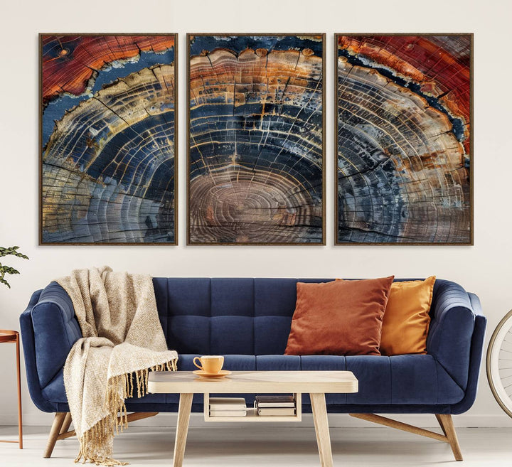 The Abstract Tree Ring Wall Art in orange, blue, and gray perfectly complements minimalist nature-inspired home decor.