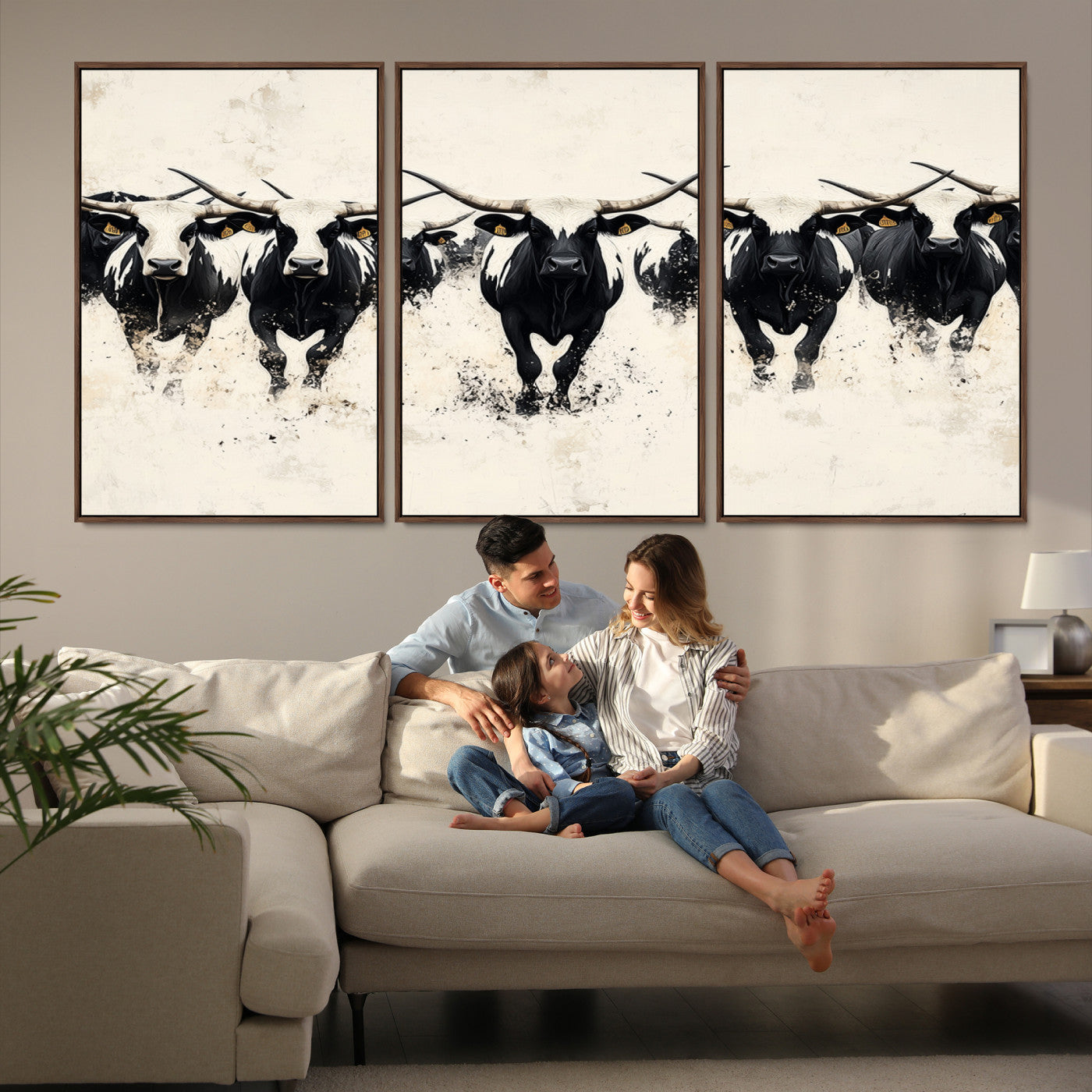 Canvas artwork of black and white Texas longhorns in a bold stampede over a minimalist background, ideal for rustic modern or Western-themed decor.