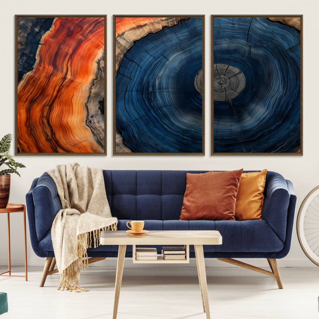 Abstract Tree Ring Wall Art Print on canvas featuring vibrant blue, orange, and brown rings with a natural rustic wood texture. Free shipping available!.