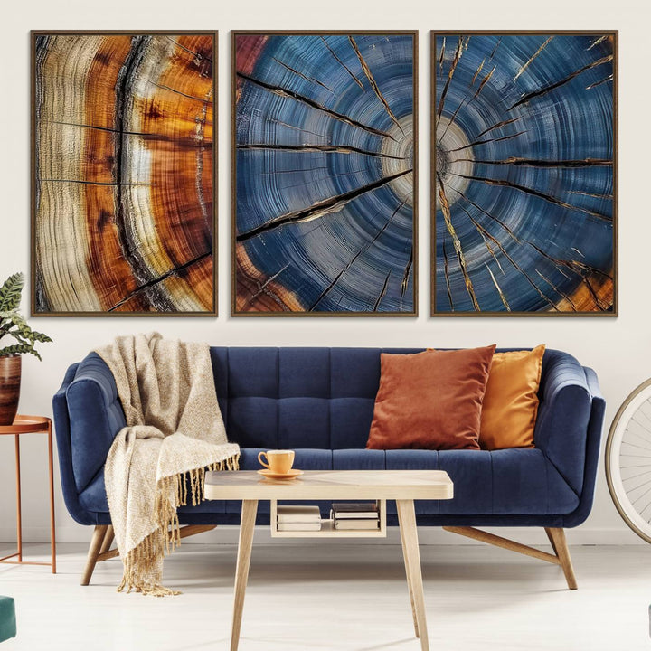 Close-up of blue, brown, and orange wood grain rings on the Abstract Tree Rings Canvas Wall Art Print.