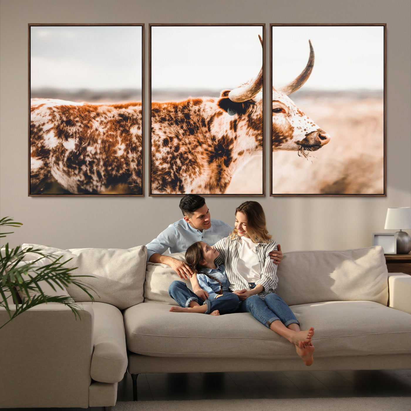 Speckled Texas longhorn with curved horns standing in a warm-toned prairie, perfect for rustic or country-style home decor.