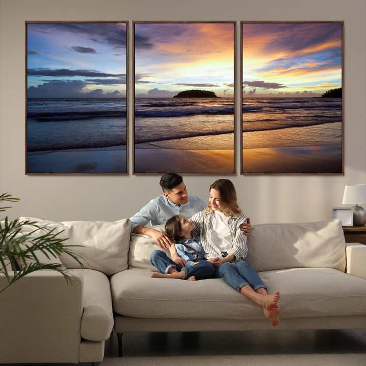 A tropical beach at sunset with waves gently washing ashore, reflecting golden and purple hues in the sky, creating a tranquil coastal scene.
