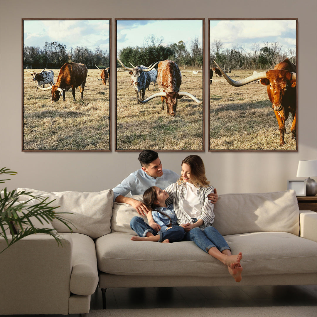 A herd of Texas Longhorn cattle grazing in an open field under a partly cloudy sky, capturing a rustic and Western ranch aesthetic.