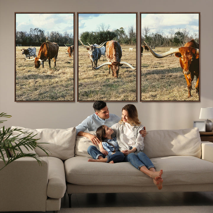 A herd of Texas Longhorn cattle grazing in an open field under a partly cloudy sky, capturing a rustic and Western ranch aesthetic.