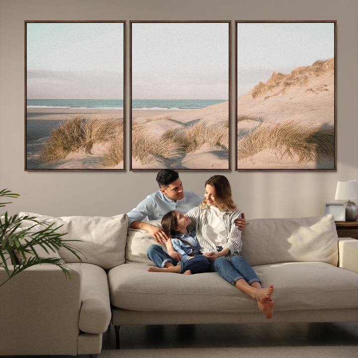 Soft pastel-toned beach scene with sand dunes, windswept grasses, and a calm ocean horizon, creating a serene coastal atmosphere.