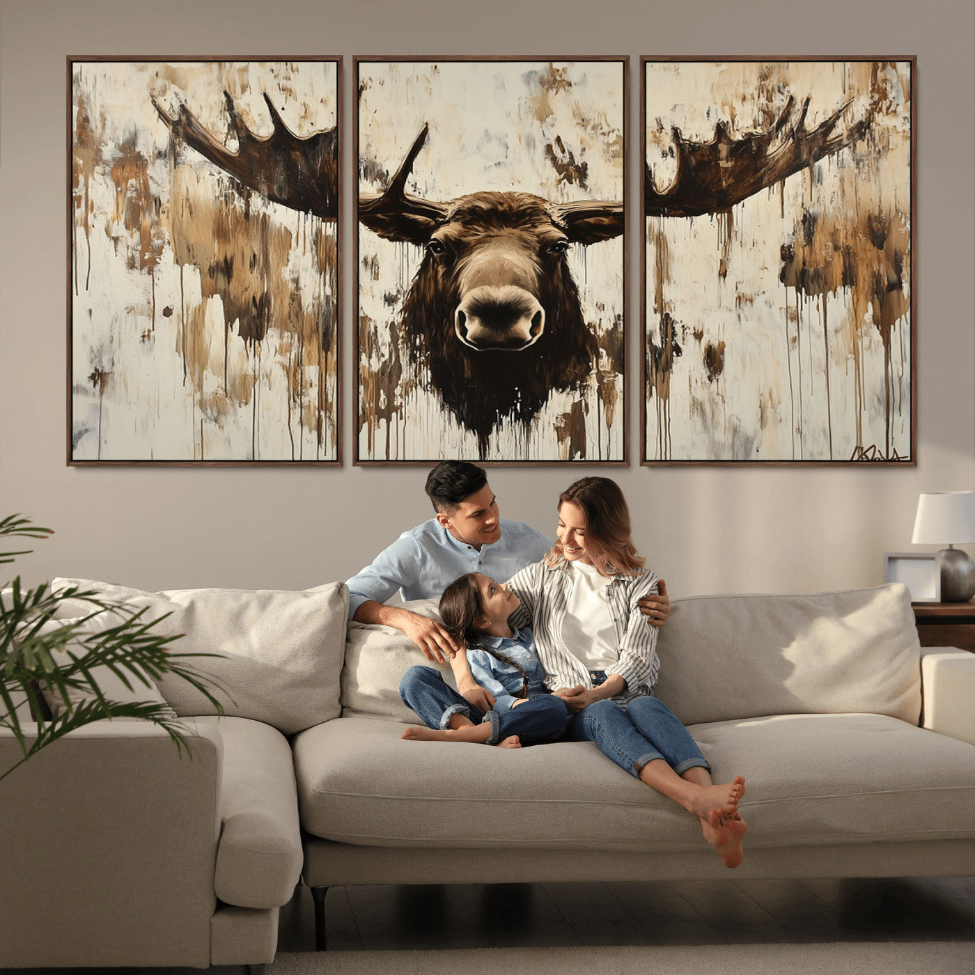 Expressive painting of a moose head with wide antlers in dark brown and beige tones, featuring paint drips and splatters on a light textured background, creating a striking rustic wall art canvas.