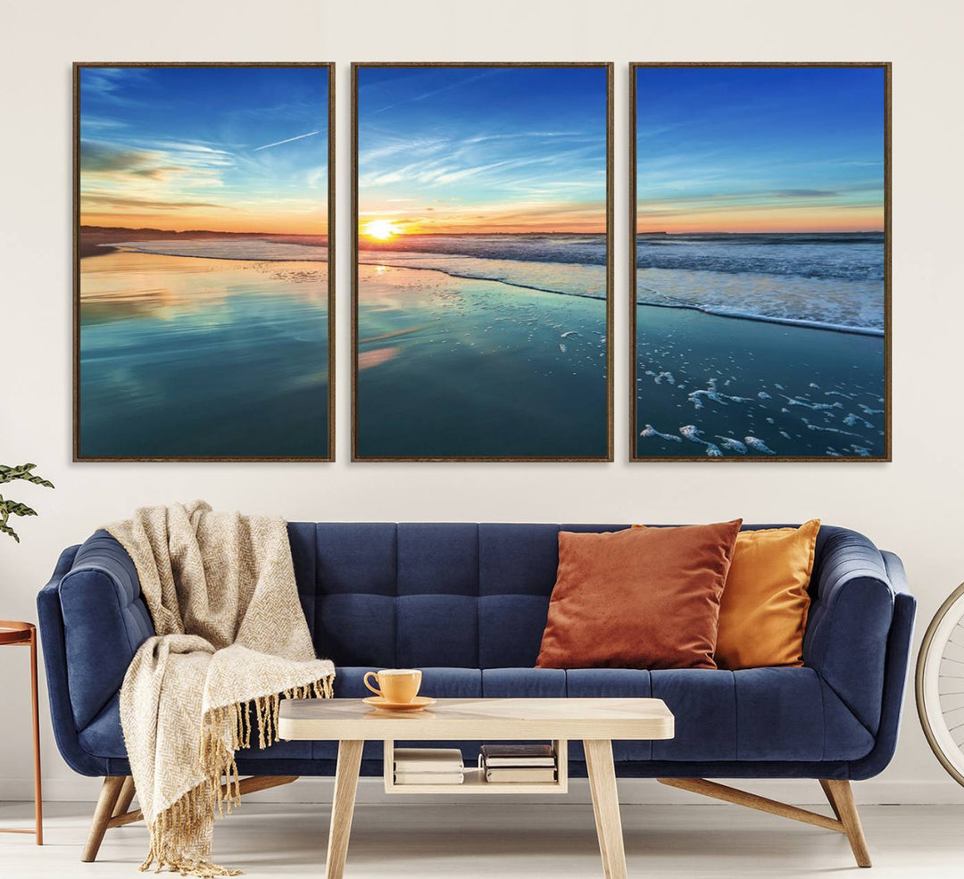 The Blue Sky and Beach Wall Art Canvas Print features a vibrant orange sky reflecting on wet sand.