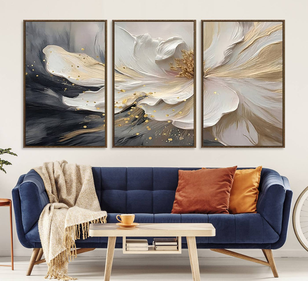 Elegant White and Gold Floral Triptych Canvas Art, a modern textured flower painting for home or office decor, features a blurred gray background.