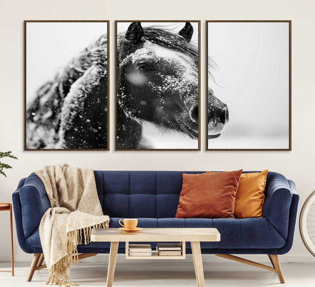 A large 3-panel rustic farmhouse wall art showcases a black and white winter horse canvas print against a snowy backdrop.