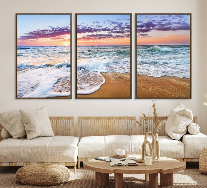 The Coastal Sunset Art Canvas Print features ocean waves beneath a vibrant sky in a stunning 3-panel seascape.