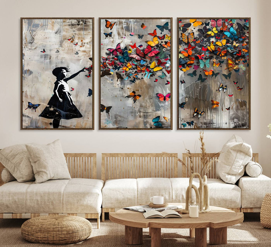 The Banksy Butterfly Girl 3-Piece Modern Graffiti Canvas Wall Art features a silhouette of a girl reaching for butterflies.