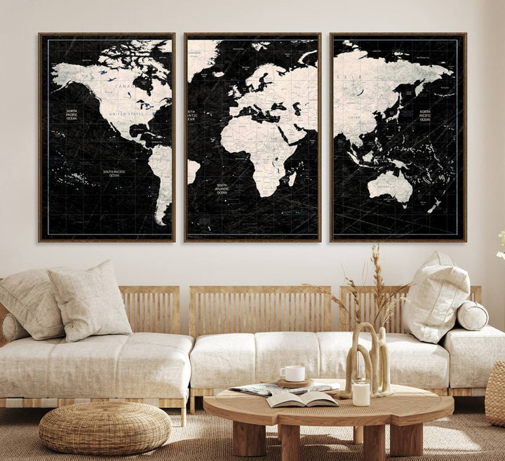 A bold global style framed black and white world map canvas print, presented in three panels, perfect for modern home or office decor.