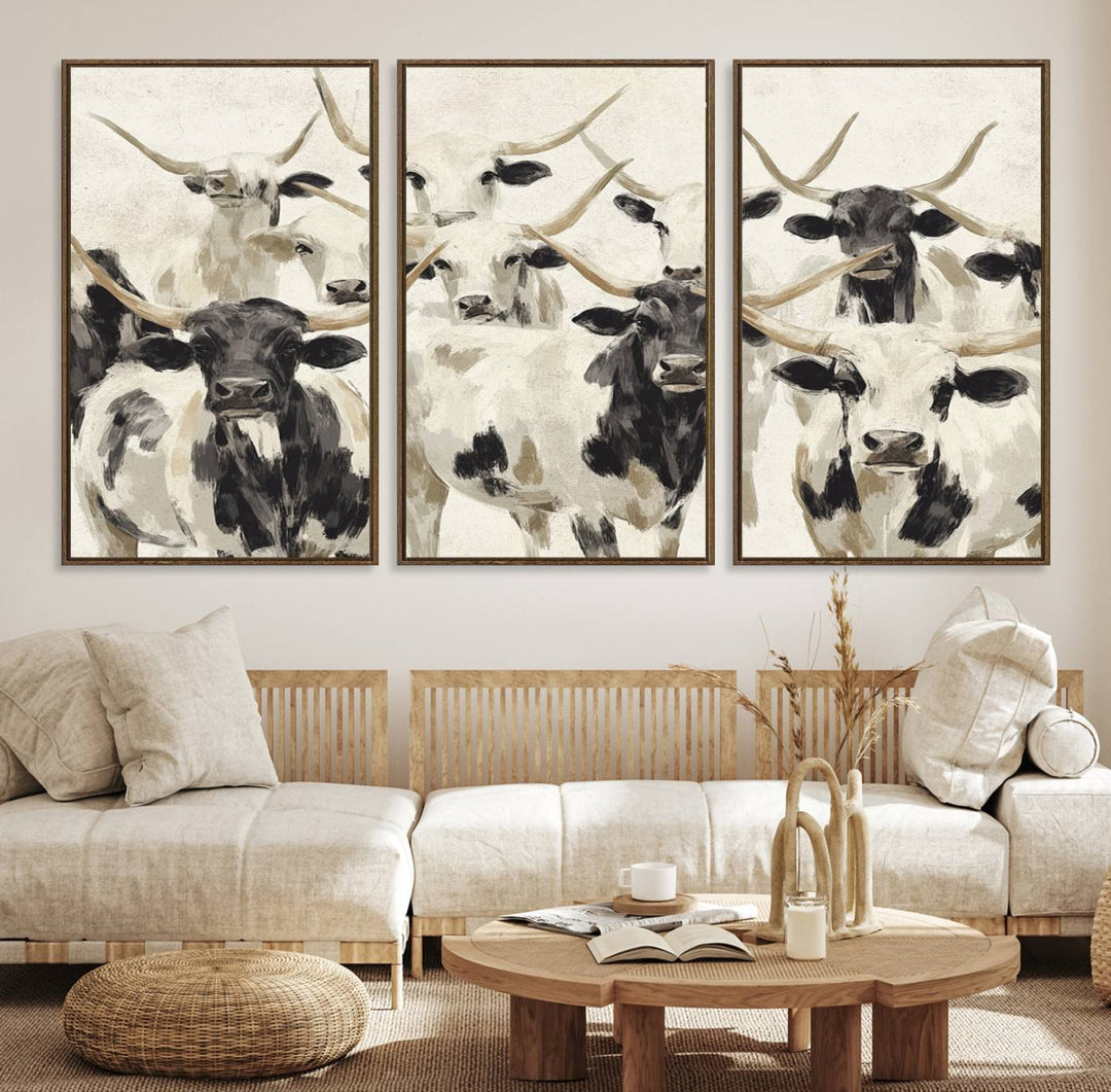 Canvas print titled Longhorn Texas Cow Drawing, depicting longhorn cattle with black and white markings, made in the USA, displayed on the wall.