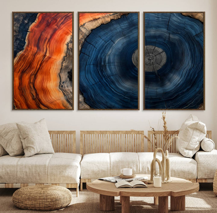 Abstract Tree Ring Wall Art Print on canvas featuring vibrant blue, orange, and brown rings with a natural rustic wood texture. Free shipping available!.