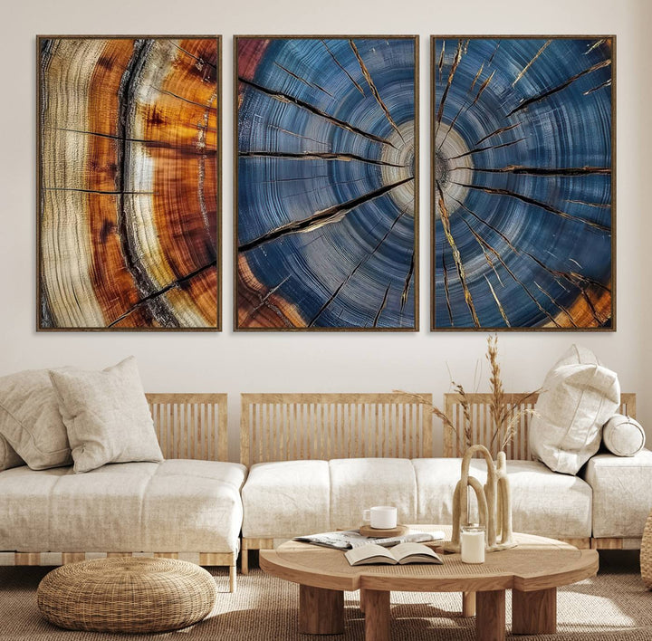 Close-up of blue, brown, and orange wood grain rings on the Abstract Tree Rings Canvas Wall Art Print.