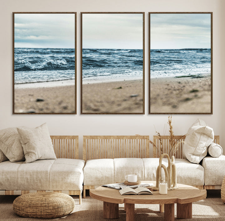 A moody ocean scene with gentle waves washing onto a sandy beach under a cloudy sky, creating a peaceful and coastal atmosphere.