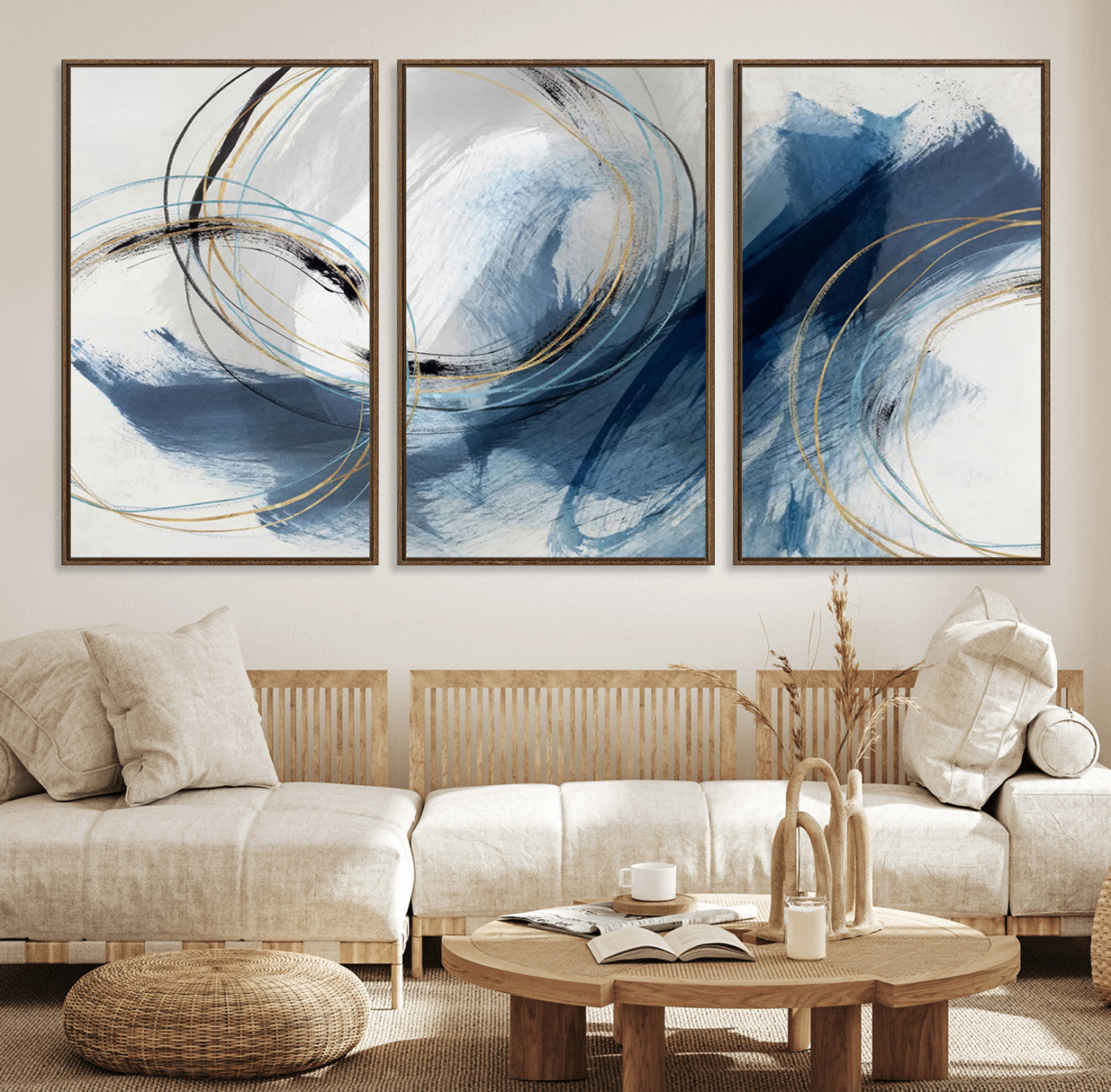 Abstract wall art featuring dynamic brush strokes in shades of blue and gray, overlaid with delicate circular line patterns in gold, black, and light blue on a white background.
