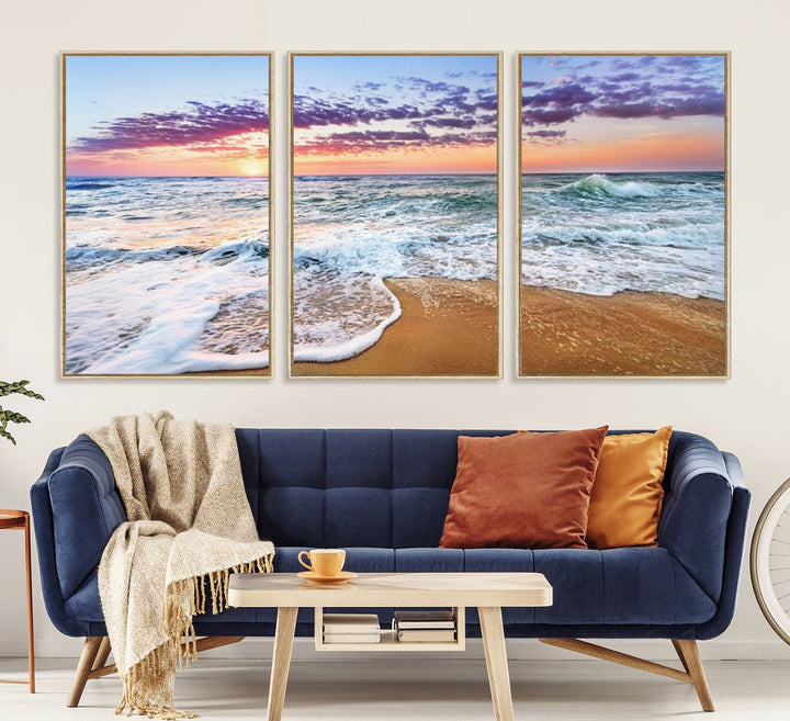 The Coastal Sunset Art Canvas Print features ocean waves beneath a vibrant sky in a stunning 3-panel seascape.