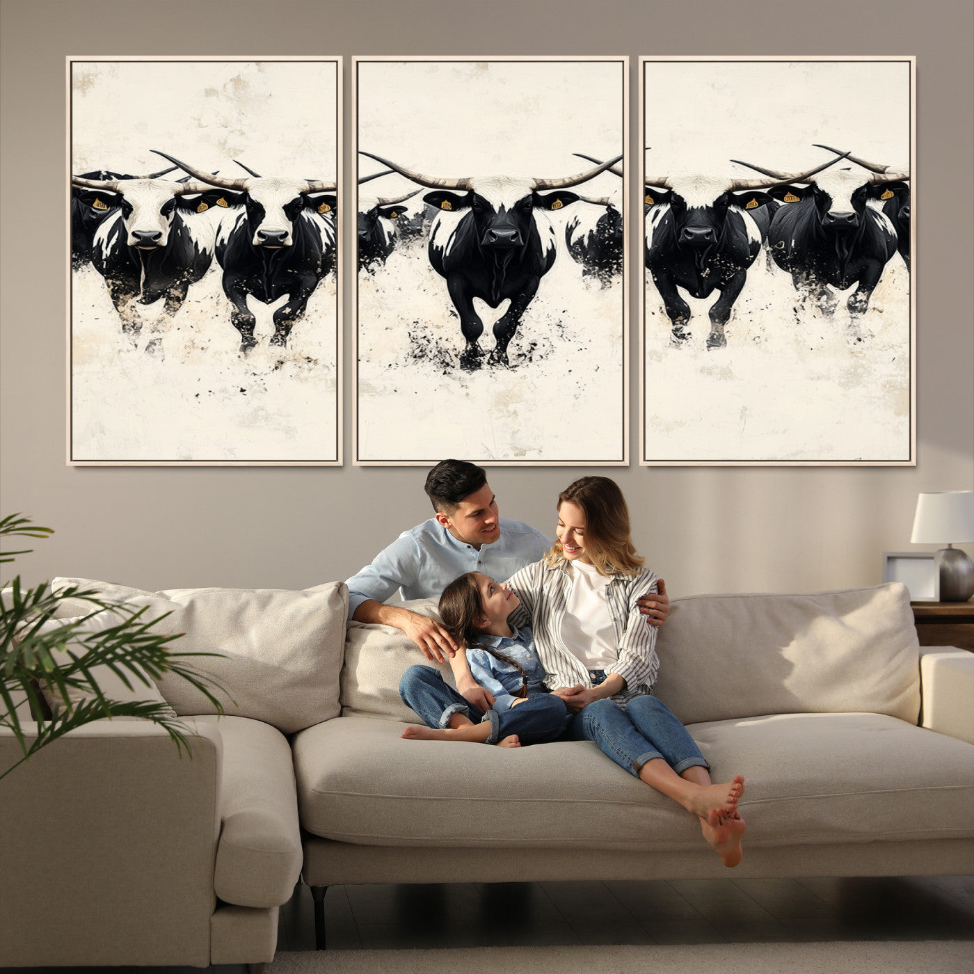 Canvas artwork of black and white Texas longhorns in a bold stampede over a minimalist background, ideal for rustic modern or Western-themed decor.