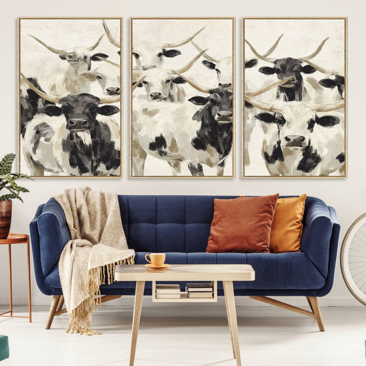 Canvas print titled Longhorn Texas Cow Drawing, depicting longhorn cattle with black and white markings, made in the USA, displayed on the wall.