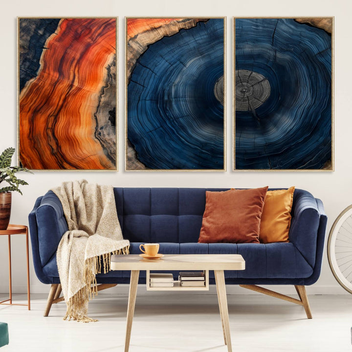 Abstract Tree Ring Wall Art Print on canvas featuring vibrant blue, orange, and brown rings with a natural rustic wood texture. Free shipping available!.