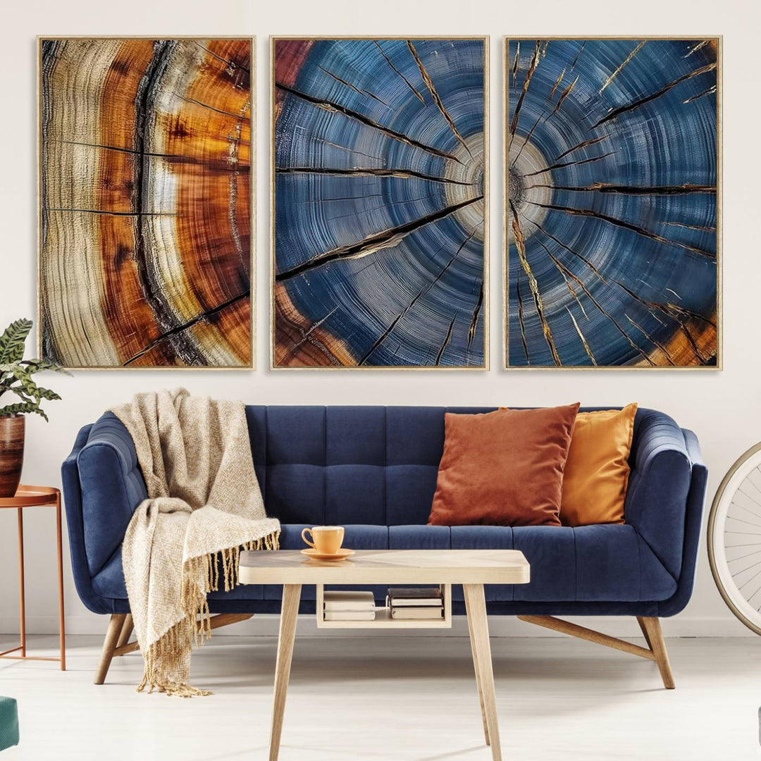 Close-up of blue, brown, and orange wood grain rings on the Abstract Tree Rings Canvas Wall Art Print.