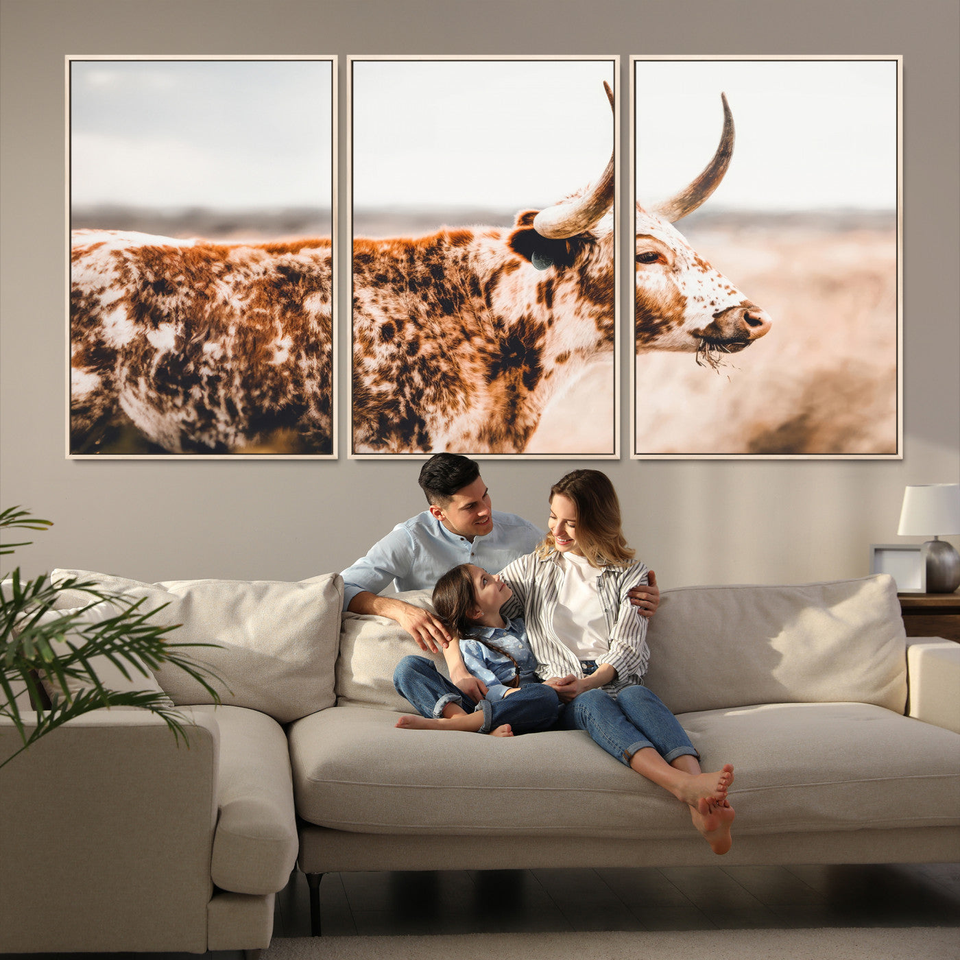 Speckled Texas longhorn with curved horns standing in a warm-toned prairie, perfect for rustic or country-style home decor.